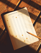 RanchWise 90-Day Tracker printable open on a wooden table with a pencil